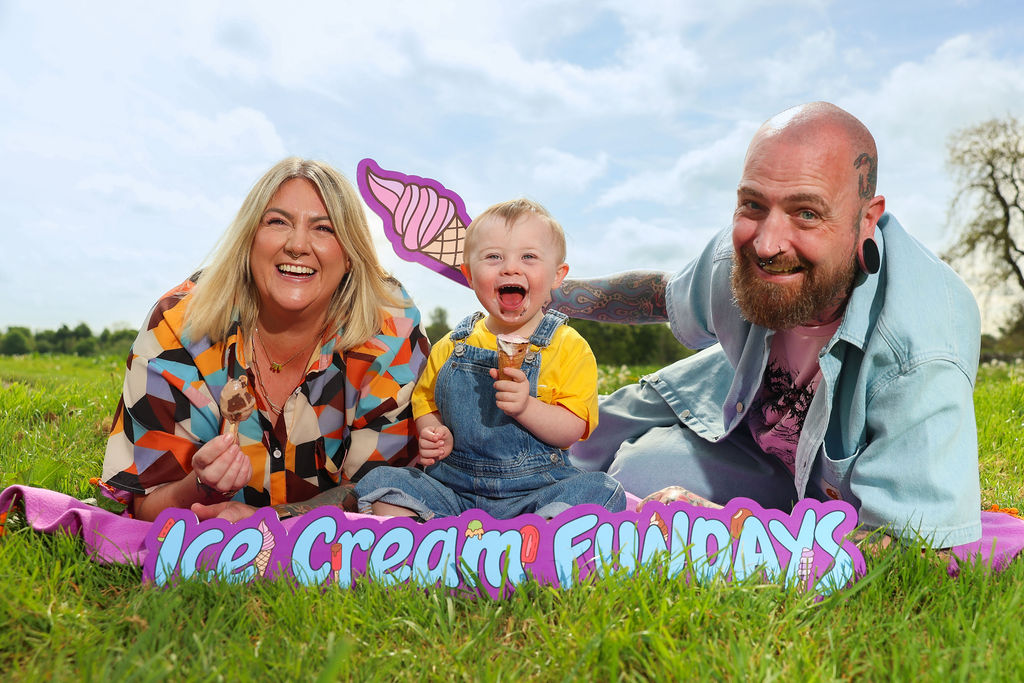 Mother and Father with baby who has Down syndrome eat ice cream