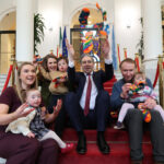 L-R Aine Farrelly with daughter Edie, Sarah Jane Lacey with son Noah, An Tanaiste Simon Harris, PJ Browne with daughter Clodagh