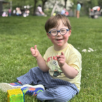Little boy with Down syndrome smiling