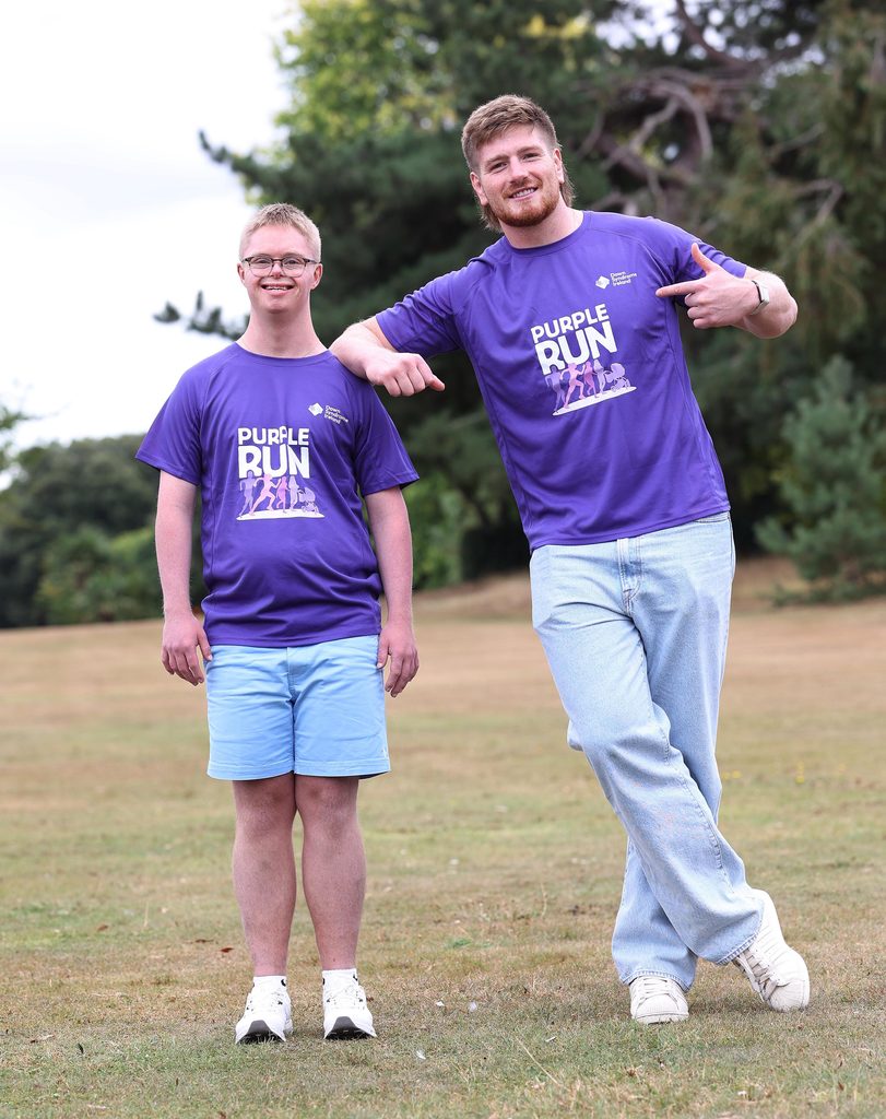 Joe McCarthy and his brother Andrew in Purple t-shirts